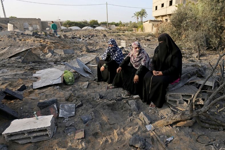 palestinian_women_sit_near_the_remains_of_a_house_destroyed_in_an_israeli_air_strike_in_the_southern_gaza_strip_november_13x_2019_