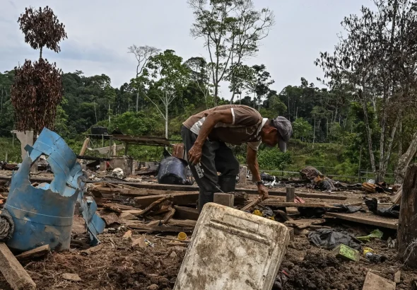 Farmer Jose Pena looks for belongings amid rubble after a bomb dropped by the Ecuadorian army in the Lago Agrio region, Sucumbios province, Ecuador, on the border with Colombia, on March 18, 2026. Photo: Luis Acosta/AFP/Getty Images.