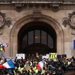 Protesters wearing yellow vests gather in front of the Opera House as part of the "yellow vests" movement in Paris