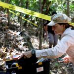 Silvana Turner of Argentine Forensic Anthropology Team (EAAF) works at the scene where it is suspected there are bodies of five victims of the El Mozote Massacre, in the village of El Mozote