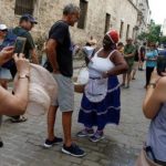 a_woman_sells_peanuts_to_tourists_on_the_streets_in_havana_.jpg_1718483346