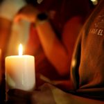 Mourners take part in a vigil at El Paso High School after a mass shooting at a Walmart store in El Paso