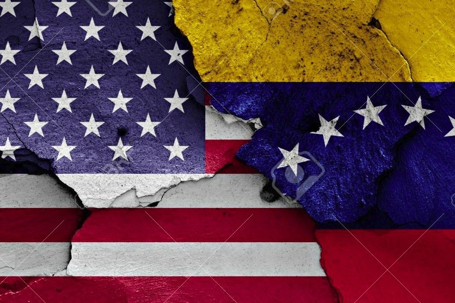 flags of USA and Venezuela painted on cracked wall