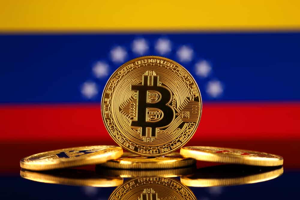 Physical-version-of-Bitcoin-new-virtual-money-and-Venezuela-Flag.-1