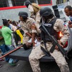 People participate during a demonstration in Port-au-Prince, Haiti, 20 October 2019. At least one person has been kille