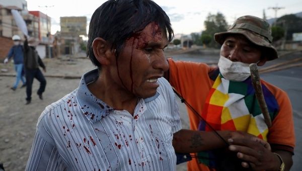 a_supporter_of_evo_morales_is_injured_by_the_jeanine_axez_administrationxs_security_forces_in_cochabambax_boliviax_nov__18x_2019_.jpg_1718483346