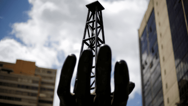 a_sculpture_is_seen_outside_a_building_of_venezuelaxs_state_oil_company_pdvsa_in_caracasx_venezuela_june_14x_2016_.png_1718483346