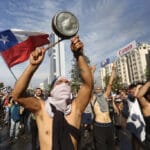 Protests Continue In Chile After President Piñera Declared State of Emergency And Suspended Subway Fare Hike
