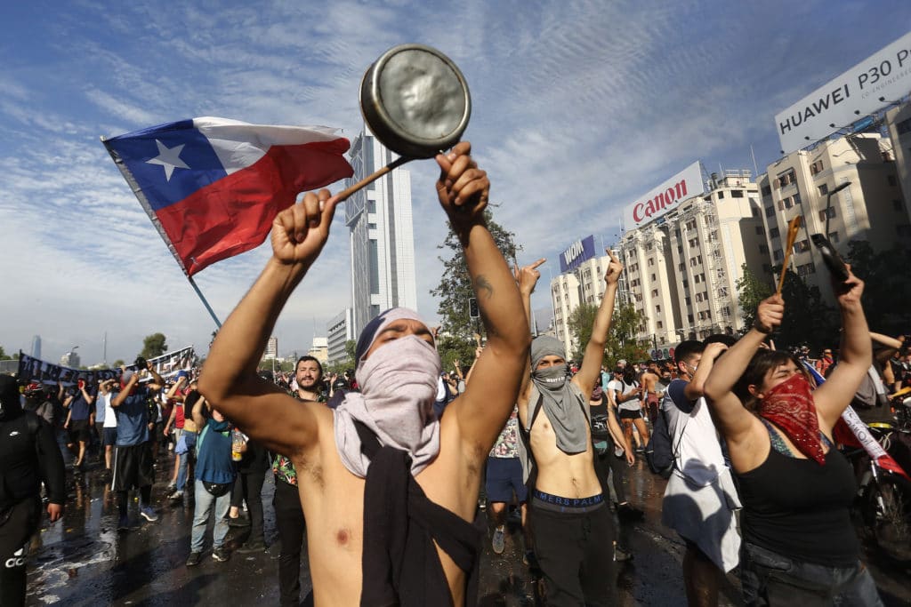 Protests Continue In Chile After President Piñera Declared State of Emergency And Suspended Subway Fare Hike