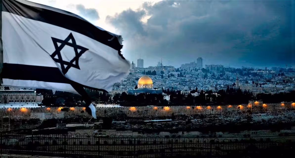 An-Israeli-flag-flutters-at-Mount-of-Olives-with-the-Old-City-of-Jerusalem-and-its-Dome-of-the-Rock-mosque-in-the-centre-March-27-2019.-AFP-1194x640