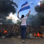 2018_Nicaraguan_protests_-_woman_and_flag