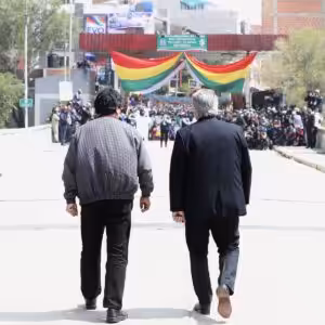 Alberto Fernandez and Evo Morales walking to the border line with Bolivia during Evo's return after one year in exile.
