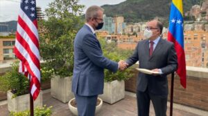 James Story, US “virtual ambassador” in Venezuela, presents his credentials to Venezuelan opponent Julio Borges in Colombia, December 7, 2020.