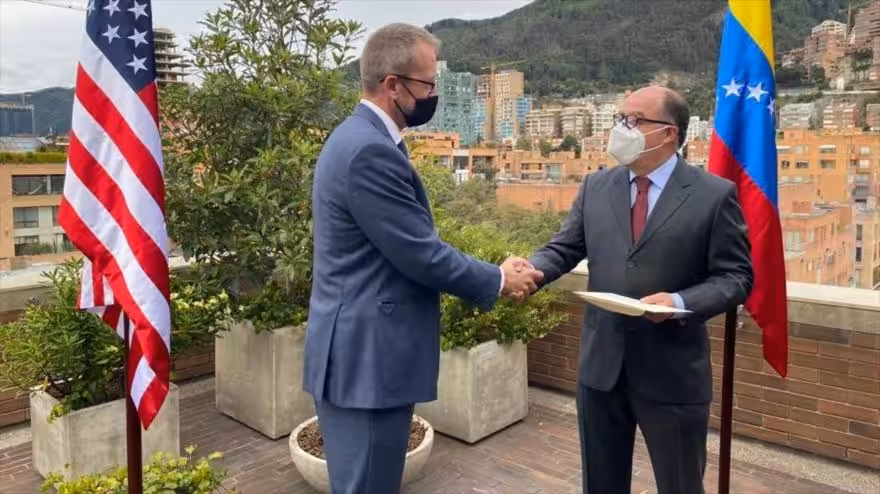 James Story, US “virtual ambassador” in Venezuela, presents his credentials to Venezuelan opponent Julio Borges in Colombia, December 7, 2020.