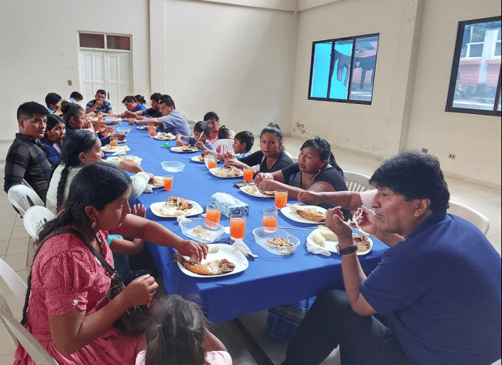 evo eating with relatives of sacaba massacre on december 24th 2020