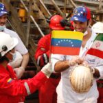 Iranian sailors greated by Venezuelan oil workers.