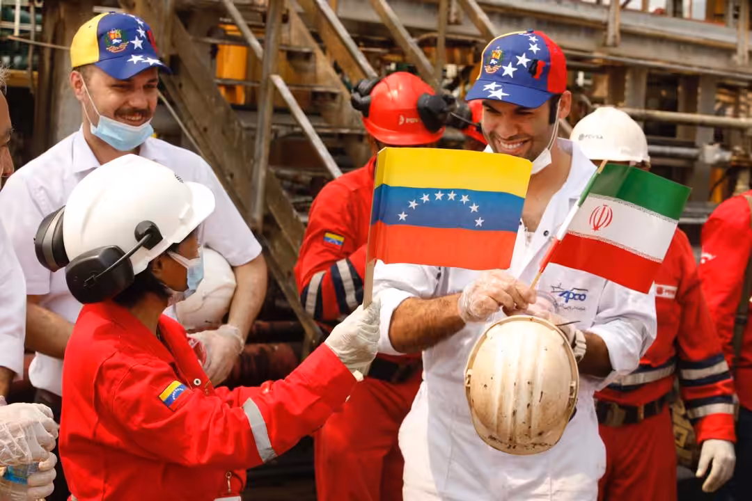 Iranian sailors greated by Venezuelan oil workers.
