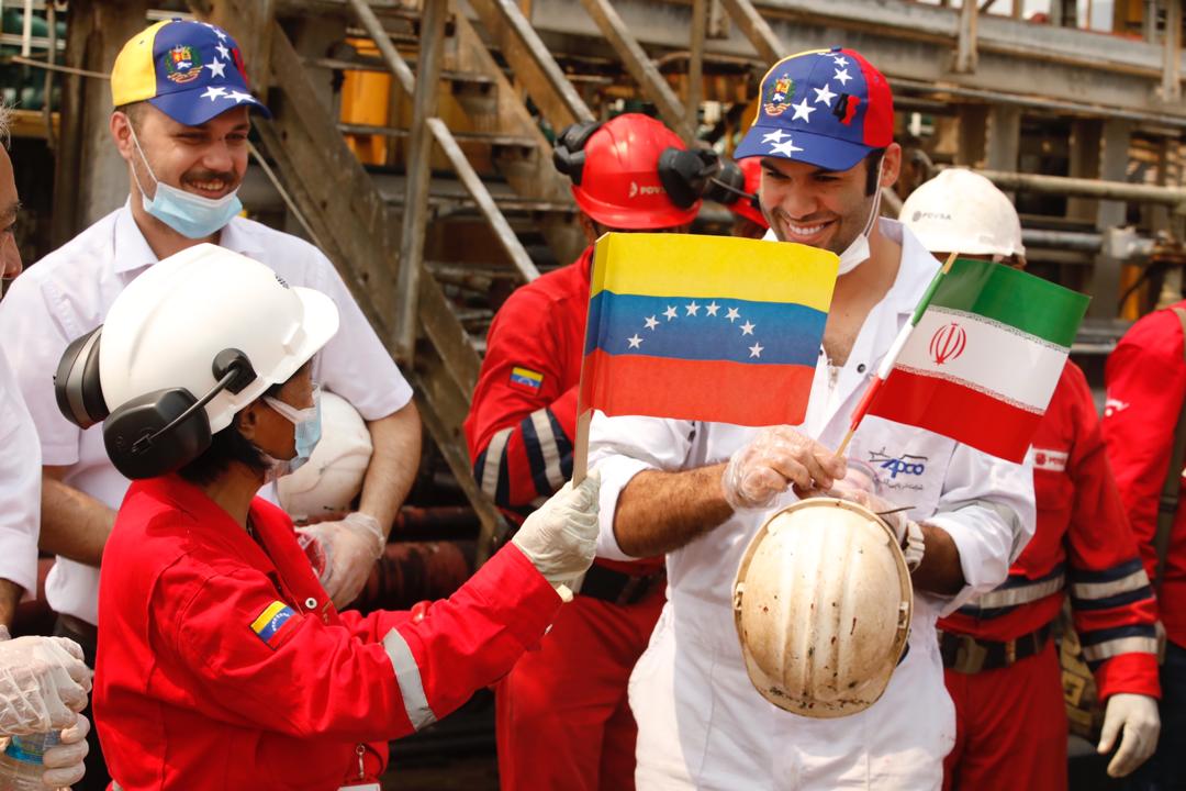Iranian sailors greated by Venezuelan oil workers.