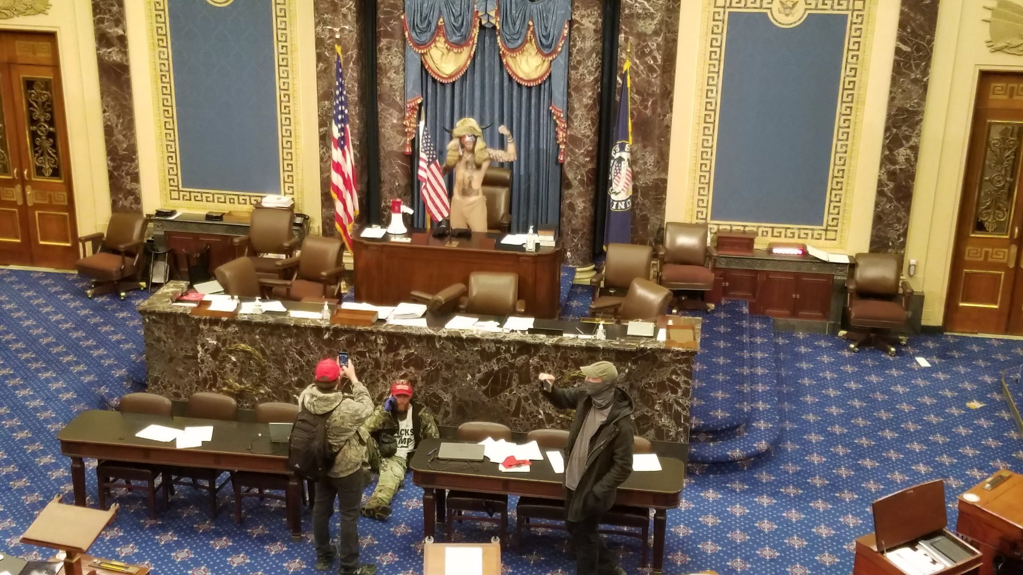 Featured image: File photo. Trump supporters took control of the Congress floor after storming the Capitol with police help. Q-anon