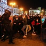 Featured image: Police excessive use of force has ignited violence in some protests demanding Pablo Hasel release. Photo courtesy of Getty Images.