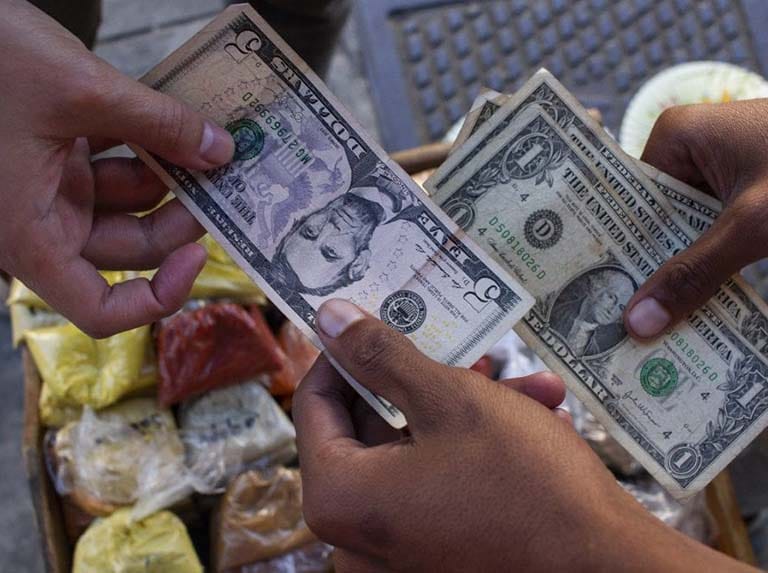 Bachaqueros (Black Marketeers) Hoarding One Dollar Bills