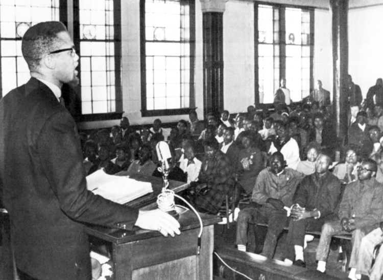 Malcolm X speaks to young civil rights fighters in Selma, Alabama, Feb. 4, 1965. In last weeks of his life, Malcolm spoke increasingly as a revolutionary leader of the entire working class. Photo courtesy of the Militant.