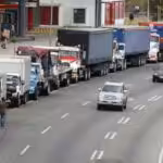 Featured image: Long lines of trucks waiting to load their tanks with fuel and adding to the long lines of cars that are still visible all over Venezuela due to the scarcity created since 2020 as a direct result of US blockade.