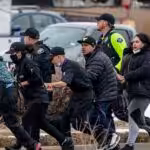 Ordinary residents of Boulder, Colorado, escaping the shooting rampage. Credit: TNS