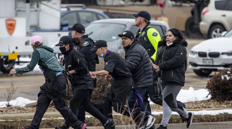 Ordinary residents of Boulder, Colorado, escaping the shooting rampage. Credit: TNS