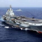 The Chinese aircraft carrier Liaoning with Chinese frigates and guided missile destroyers participating in a military exercise in the Western Pacific, April 2018.