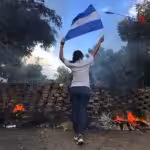 1024px-2018_Nicaraguan_protests_-_woman_and_flag