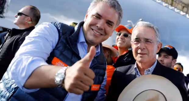 Featured image: Colombian president Ivan Duque with his political mentor Alvaro Uribe accused of  corruption and involvement with narco traffic. File photo.