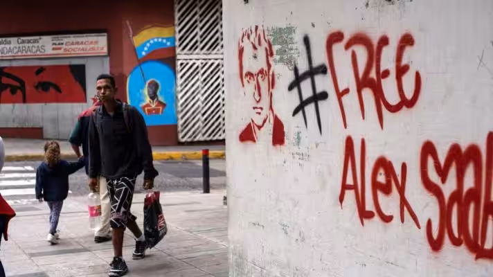 Featured image: Dozens of street paintings like the one in the photo have covered Caracas in recent months with the caption #FreeAlexSaab. File photo.