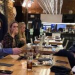 Venezuelan fugitive, Leopoldo Lopez can be seen in this photo in the background just in front of his wife Lilian Tintori in the expensive "La Carlota" restaurant where they were spotted last weekend. File photo courtesy of RedRadioVE.