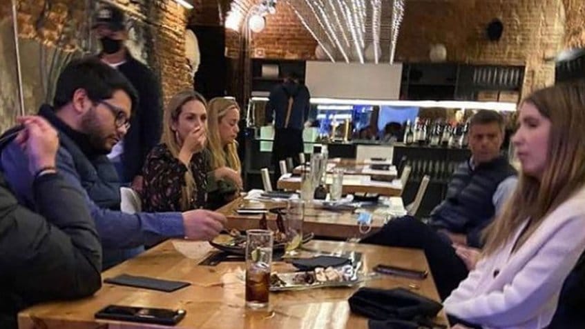 Venezuelan fugitive, Leopoldo Lopez can be seen in this photo in the background just in front of his wife Lilian Tintori in the expensive "La Carlota" restaurant where they were spotted last weekend. File photo courtesy of RedRadioVE.