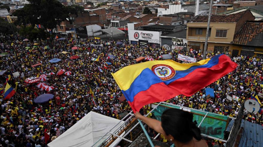 Featured image: Protesters participate in a protest against the Government of Colombian President Iván Duque in Cali, May 19, 2021. (Photo: AFP).