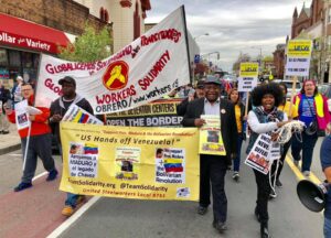The president of the union (center), Andres Francoise, marching in Boston hanging a yellow sing in support of President Maduro. Photo courtesy of USW Local 8751.