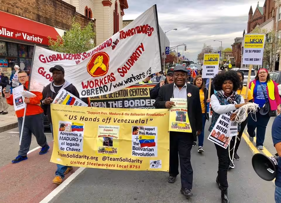 The president of the union (center), Andres Francoise, marching in Boston hanging a yellow sing in support of President Maduro. Photo courtesy of USW Local 8751.