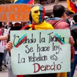 Featured image: Peaceful demonstrators march through the streets during a new day of protests in the "national strike" called by unions and social organizations. Photo: EFE.