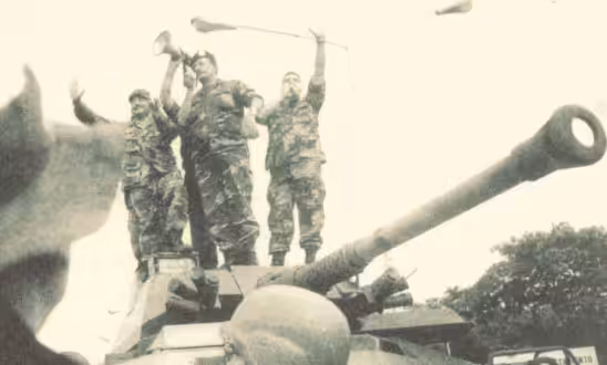 Featured image: General Garcia Carneiro talking to the Chavista mass of people that went to Fuerte Tiuna in Caracas demanding the return of Hugo Chavez during the 2002 coup d'etat. File photo.