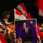 Supporters of Syria's President Bashar al-Assad celebrate before the results of the presidential election in Damascus, Syria, May 27, 2021. REUTERS/Omar Sanadiki