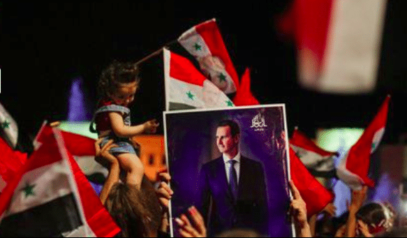 Supporters of Syria's President Bashar al-Assad celebrate before the results of the presidential election in Damascus, Syria, May 27, 2021. REUTERS/Omar Sanadiki