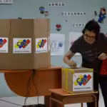 A woman votes during regional elections in Caracas on Sunday. Divisions among the opposition may hit turnout. Photograph: Federico Parra/AFP/Getty Images