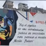 Featured image: Street mural in Caracas with the face of Alex Saab and the caption “I’m the object of an unprecedented legal persecution to oust President Nicolas Maduro.” File photo.