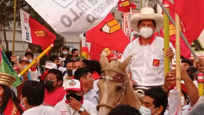 Featured image: Progressive Peruvian presidential candidate Pedro Castillo riding a horse during a political rally. File photo.