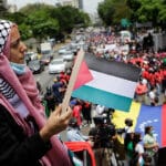 Featured image: A woman from the Palestinian community in Venezuela holds a Palestinian flag during a mobilization in favor of the Palestinian people, in Caracas Venezuela, on Tuesday, May 25, 2021. Photo: Jesús Vargas, AVN