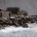 Members of the special forces unit watch an empty boat at the shore, after Venezuela's government announced a failed mercenary incursion, in Macuto, Venezuela, May 3, 2020. REUTERS/Manaure Quintero