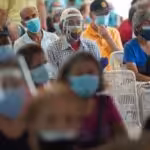 Featured image: Venezuelan senior citizens waiting to be vaccinated in the umprecedented vaccination campaign launched by President Maduro despite US and European blockade. Photographer: Manaure Quintero/Bloomberg.