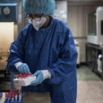 Venezuelan manipulating blood samples. © Sputnik / Magda Gibelli.