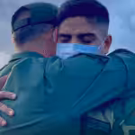 Featured image: Venezuelan Minister for Defense, Vladimir Padrino receiving with affection one of the soldier release from Colombian narco terrorist gangs captivity. Photo courtesy of CEOFANB.